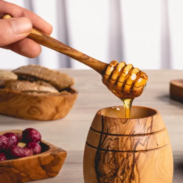 Élégant pot à miel artisanal en bois d’olivier.