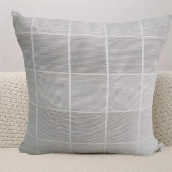 Housse de coussin en tissu de haute qualité avec fermeture zip discrète.